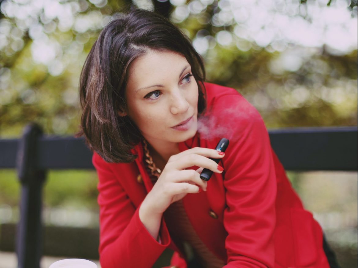 woman in red vaping